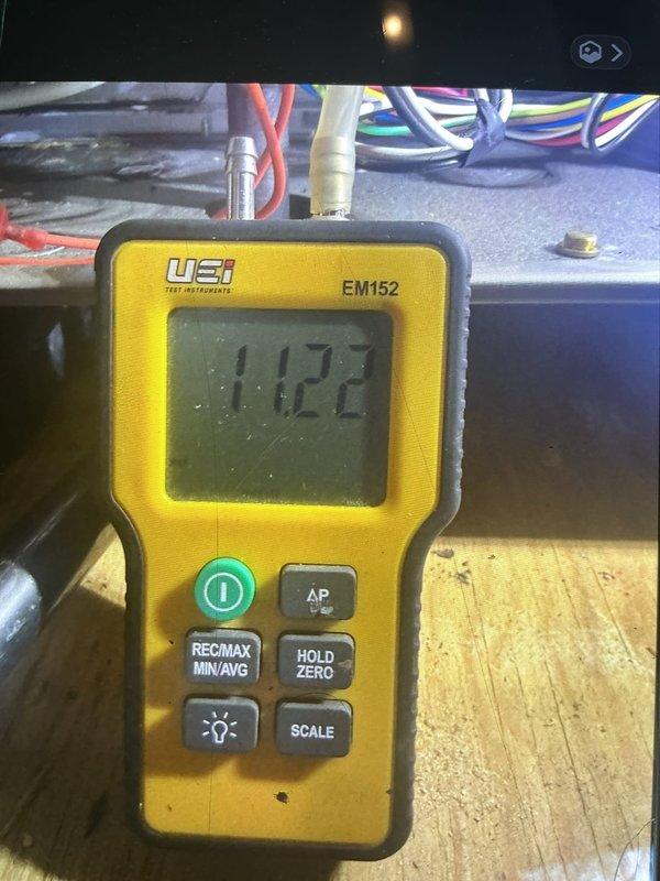 Installed 4" B-vent from furnace through roof to provide proper venting for combustion gases. Coordinated with roofing contractor on-site who supplied and installed flashing for metal roof penetration. Verified draft pressure readings using digital manometer, confirming proper system operation with readings of 6.05 and 11.22 recorded during testing and diagnostics.