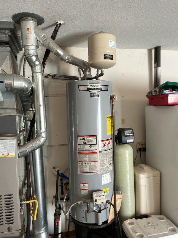 Completed routine heating maintenance on a 7-year-old Carrier furnace located in garage utility room. Performed comprehensive system inspection including burner assembly, heat exchanger, blower motor, and all safety controls. Replaced air filter per customer request, retrieving new filter from storage box on freezer. Verified proper operation of Aprilaire humidifier integrated with system. Checked gas pressure, tested ignition sequence, and confirmed adequate airflow throughout ductwork. All components operating within manufacturer specifications with no deficiencies noted. System running efficiently and ready for heating season.