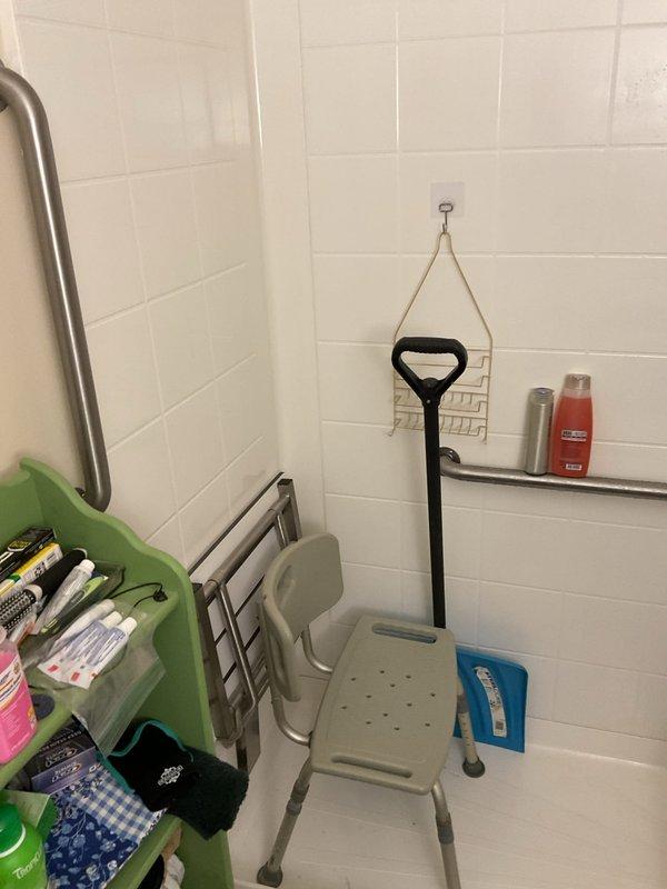 Completed on-site assessment for conversion of existing walk-in shower to tub-shower combination unit. Evaluated current accessibility features including grab bars, shower chair placement, and handheld shower fixture configuration. Documented existing white subway tile surround, chrome fixtures, and shower pan dimensions to provide accurate estimate for fixture replacement and necessary plumbing modifications.