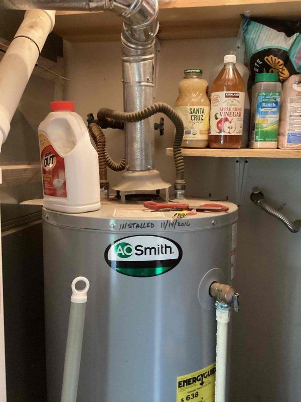 Conducted complimentary in-home consultation for whole house water treatment system installation. Assessed existing plumbing infrastructure including AO Smith water heater installed in 2016 located in utility area beneath sink cabinet. Evaluated customer preference for saltless water conditioning system and discussed available options. Documented current setup including water heater connections, flexible supply lines, PVC drainage system, and available installation space in utility closet area. Photographed existing equipment configuration and plumbing layout to facilitate accurate system design and quote preparation. Confirmed installation timeframe preference and provided technical recommendations for whole house water treatment solution compatible with current residential plumbing system.