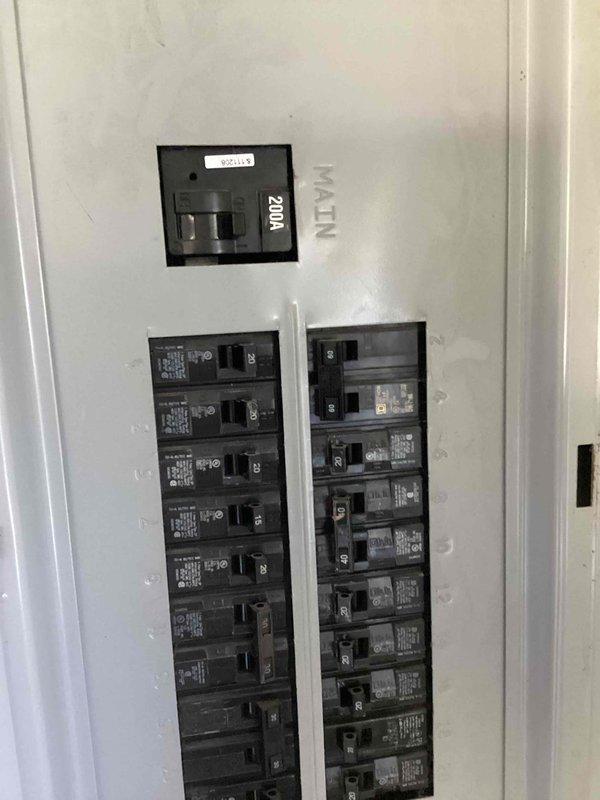 Provided estimate for replacing existing electric tank-style water heater with electric tankless unit in basement location. Evaluated electrical panel capacity, confirming 200-amp main service with available breaker positions to accommodate tankless water heater electrical requirements.