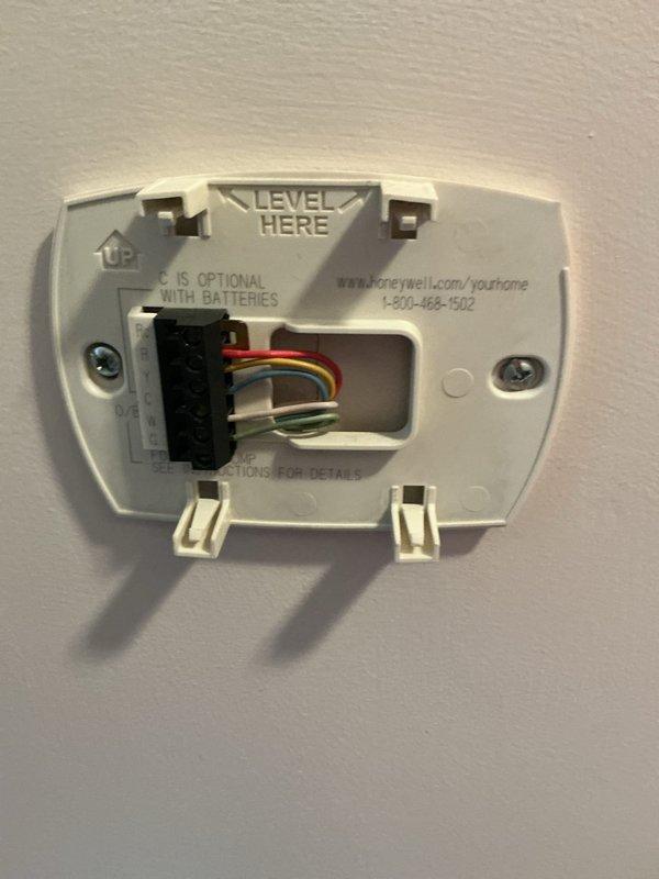 Responded to service call for complete furnace failure affecting entire residence. Evaluated 30-year-old 80,000 BTU propane gas furnace that had ceased operation. Documented existing equipment configuration including thermostat wiring connections and furnace installation in basement mechanical room. Provided comprehensive replacement estimate for new heating system due to age and failure of existing unit.