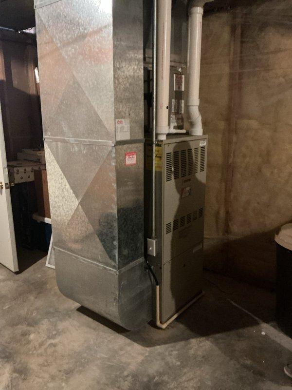 Responded to service call for complete furnace failure affecting entire residence. Evaluated 30-year-old 80,000 BTU propane gas furnace that had ceased operation. Documented existing equipment configuration including thermostat wiring connections and furnace installation in basement mechanical room. Provided comprehensive replacement estimate for new heating system due to age and failure of existing unit.