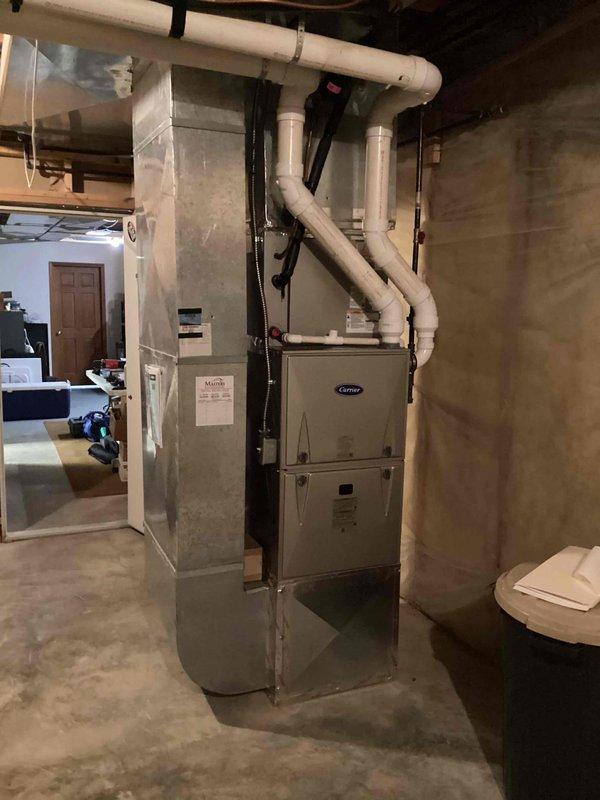 Removed and recycled the existing 80% furnace and installed a new Carrier Comfort Series 59SC6A080M21 single-stage gas furnace, upgrading to a 90%+ condensing configuration with PVC venting and a #2 installation kit, and reconnected the existing supply and return ductwork. Installed an LP conversion kit and a new Honeywell S200 FocusPro thermostat, then reviewed system and thermostat operation, completed a post-install walkthrough and quality assurance check, and registered the manufacturer warranty. Floor protection was used throughout and the work area was cleaned up on completion.