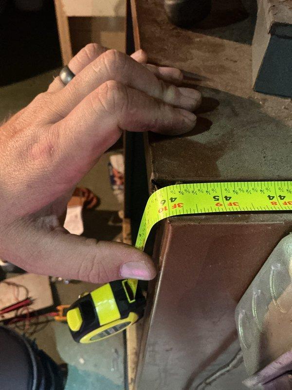Performed on-site estimate for replacement of two furnaces, inspecting the existing units in the basement utility space and measuring cabinet and supply plenum dimensions to ensure proper equipment sizing and fit. Documented the heavy dust accumulation, corrosion on the cabinets and hardware, and the condition of the existing ductwork connections to support the replacement quote.