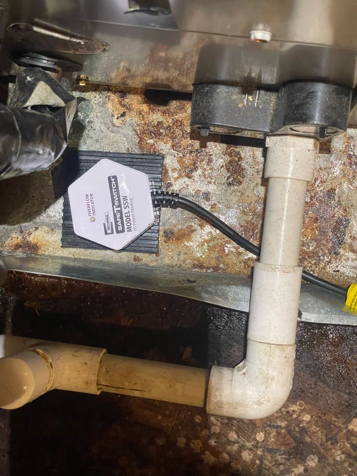 Huntingtown, MD - Installing a wet switch to deter condensate overflow in an attic on a Payne air handler Huntingtown, MD - Installing a wet switch to deter condensate overflow in an attic on a Payne air handler