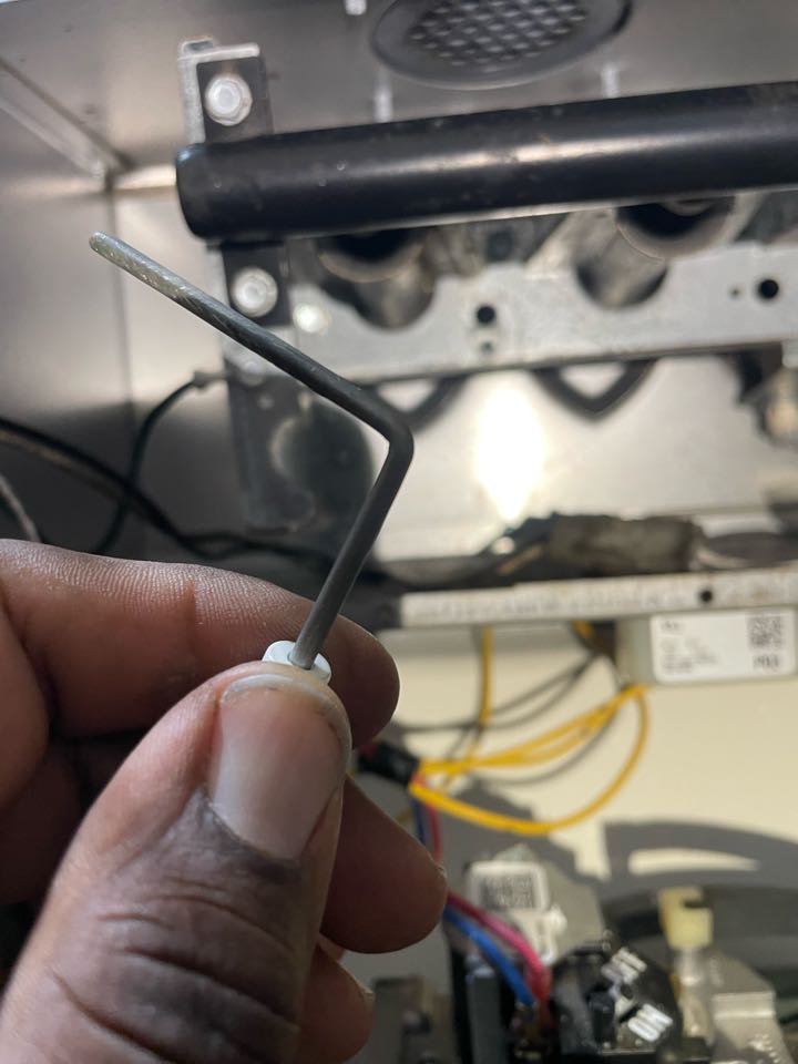 Prince Frederick, MD - Cleaning a flame sensor on a Trane propane furnace to ensure flame rectification.  Prince Frederick, MD - Cleaning a flame sensor on a Trane propane furnace to ensure flame rectification.