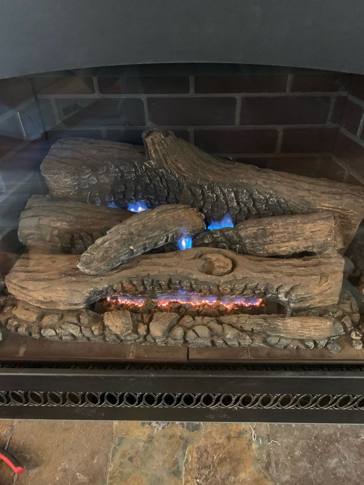 Maintained gas log fireplace