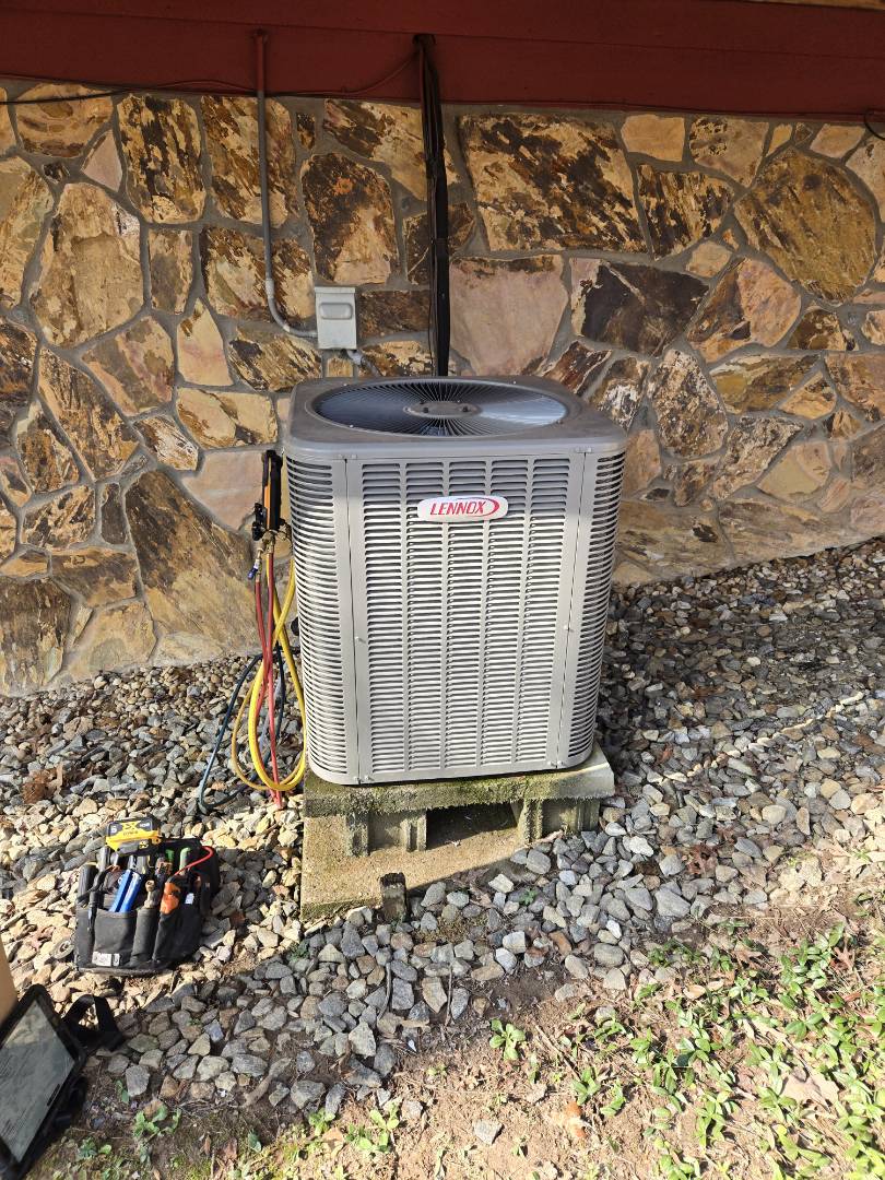 Heating maintenance to Lennox heat pump system .