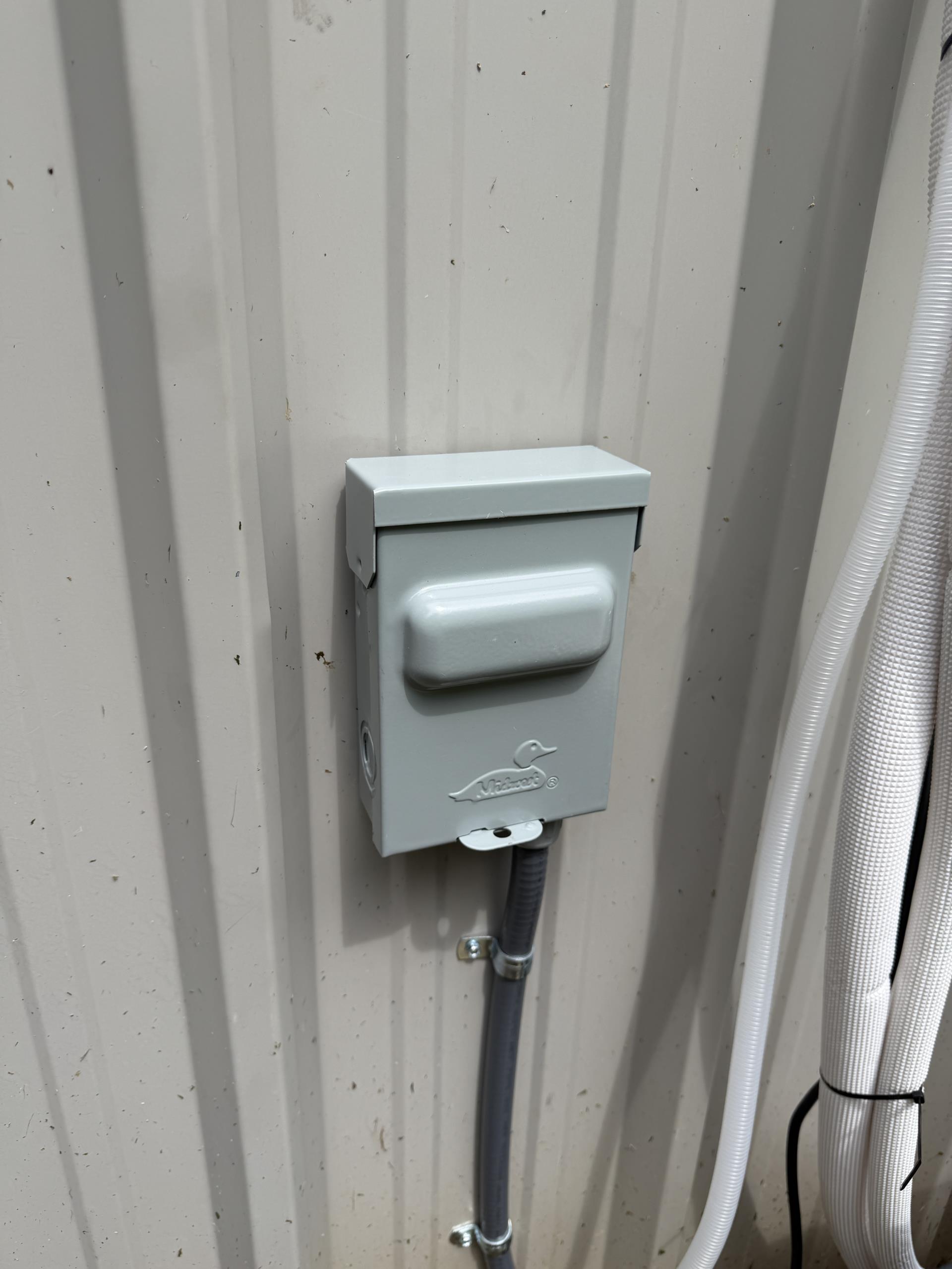 I installed a new dedicated 220-volt circuit for the mini-split system, starting from the electrical panel. I connected it to a 20-amp double-pole breaker, ensuring compliance with safety standards. The circuit was run using liquid-tight flexible conduit, specifically Seal-Tite, to protect against environmental factors. An outdoor non-fusible disconnect was installed, providing a safe means to isolate the circuit. From the disconnect, I installed a liquid-tight whip to the mini-split unit, completing all necessary electrical terminations. I secured all wiring and conduit to prevent any movement or damage. Finally, I tested the circuit to verify proper operation, ensuring everything functioned as intended.