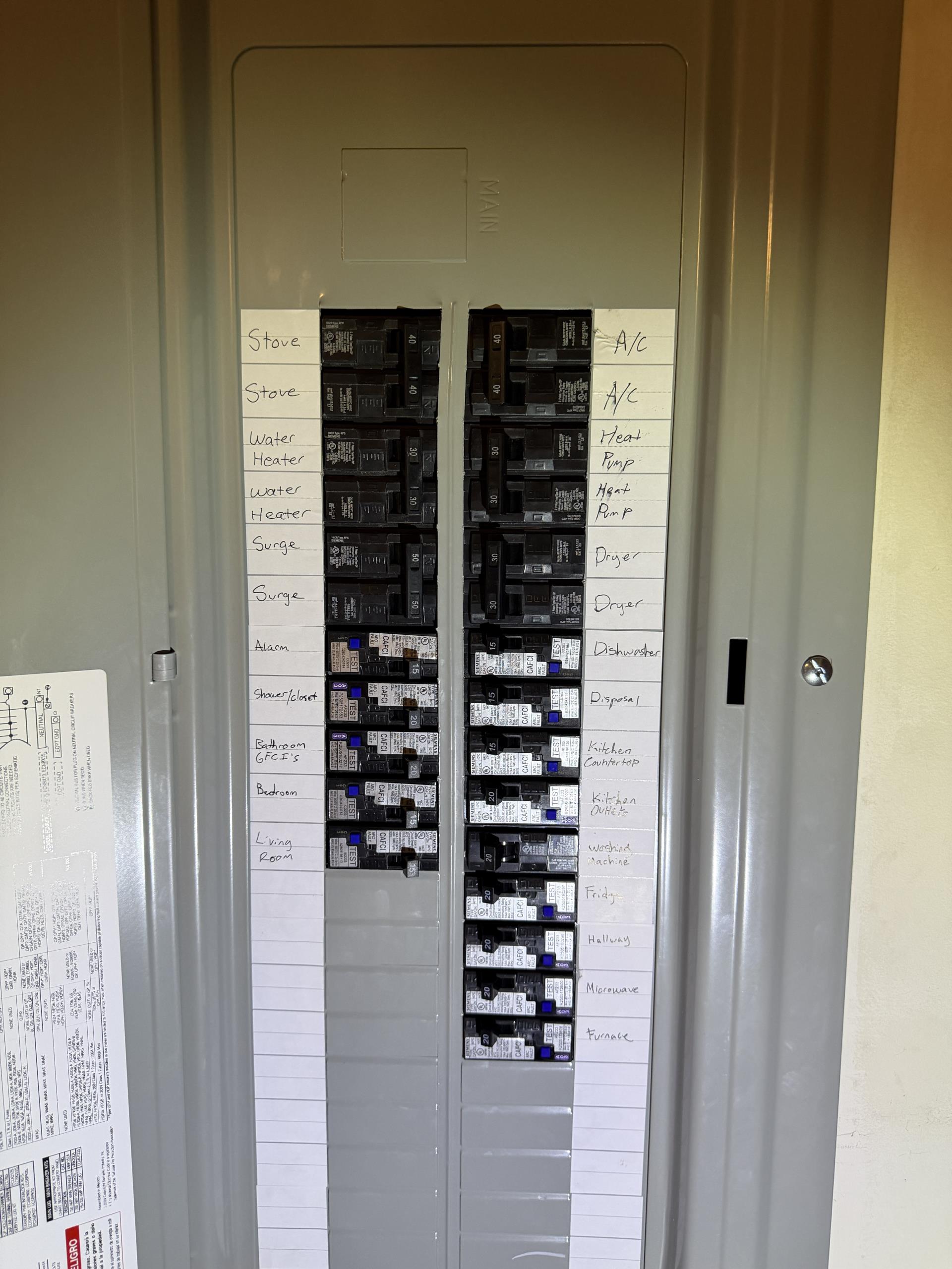 We replaced the existing interior electrical load center with a new UL-listed unit, enhancing safety and reliability. The old panel was removed, and new UL-listed circuit breakers were installed. Branch circuits were transferred, terminated, and identified in the new panel. AFCI protection was added to applicable 120-volt circuits to reduce arcing fault risks. A Type 1 whole-home surge protection system was installed at the panel to safeguard appliances and electronics. All labor, materials, and system testing were included, with any additional code issues documented separately.