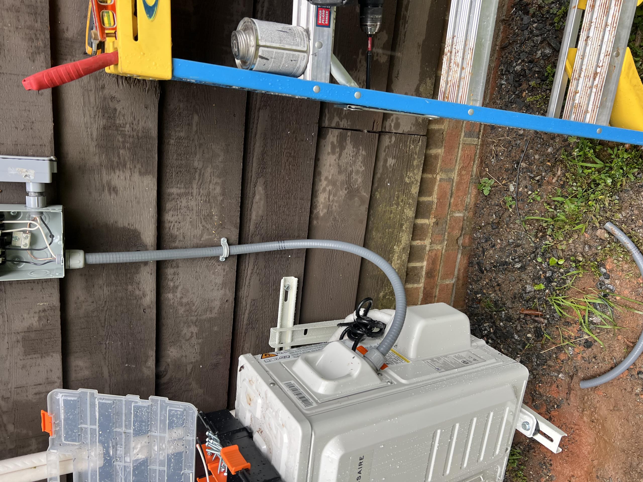 Today, I installed a new 20-amp branch circuit for the mini-split system in the detached garage. The circuit was routed from the electrical panel to the outdoor disconnect, adhering to all relevant electrical codes. A new flexible liquid-tight whip was installed between the disconnect and the mini-split condenser. After completing all electrical connections, the circuit was energized and tested for proper operation. The mini-split system is now fully functional, providing cold air at the indoor unit. The installation was completed neatly and professionally, ensuring safe and designed operation.