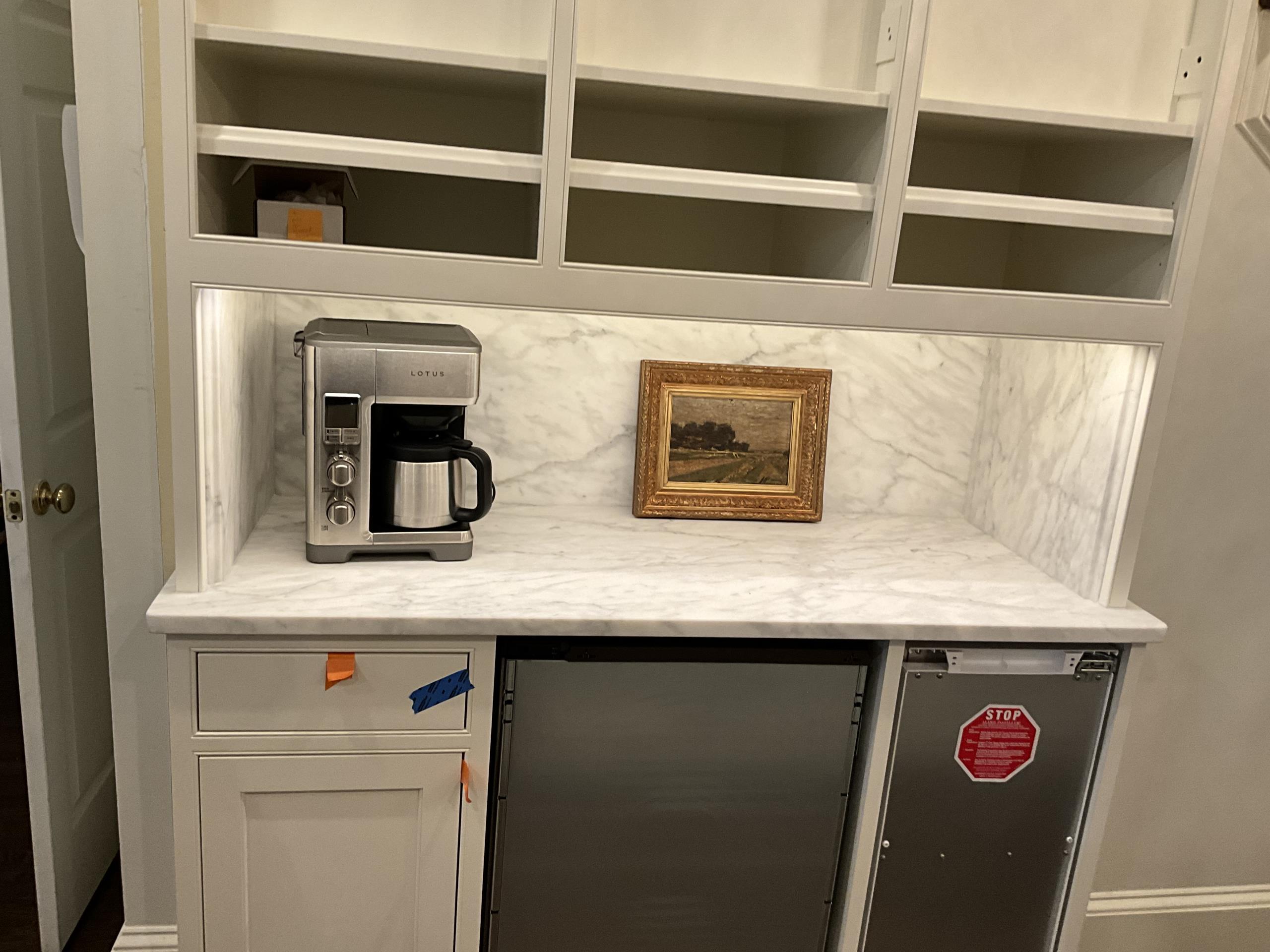 SurePoint Electric completed the electrical scope for a residential kitchen remodel, adhering to electrical codes and standards. Tasks included installing new junction boxes, relocating branch circuit wiring, and adding dedicated receptacles for the dishwasher and garbage disposal. Three USB/USB-C combination receptacles were installed, along with a concealed power strip for kitchen island appliances. Wiring was adjusted for the Sub-Zero refrigerator and LED under-cabinet lighting, including a smart switch system. Two additional 20 amp circuits were added for the microwave and warming drawer. All installations were tested for proper operation and safety.