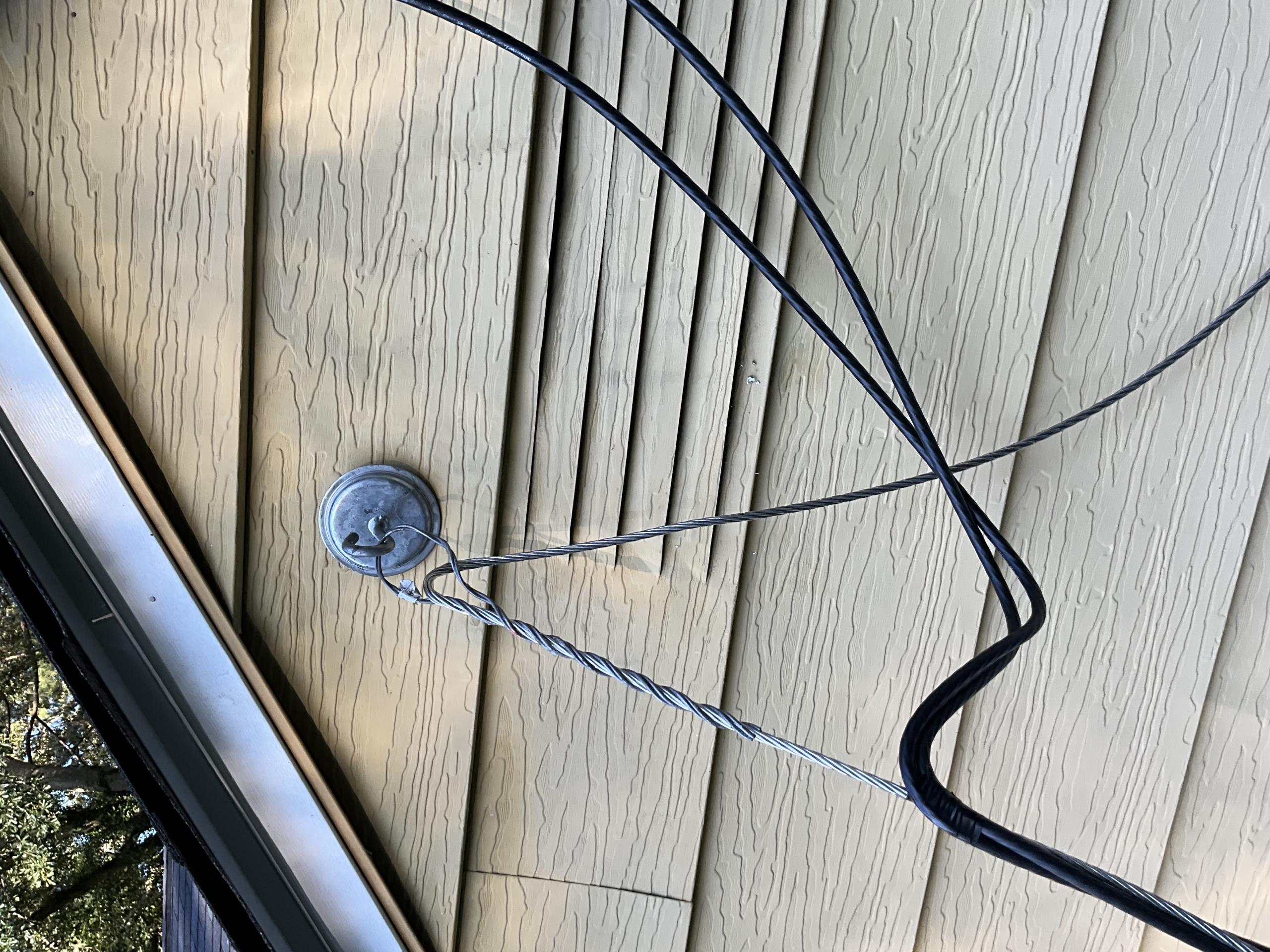 I meticulously removed the damaged service entrance SEU weatherhead, ensuring all existing service entrance conductors were safely disconnected. I replaced the weatherhead with a new utility-rated service attachment eye bolt mast anchor, aligning it precisely to meet current NEC standards. The new assembly was securely attached, and I re-terminated the conductors, preserving any suitable existing wiring. I confirmed all electrical connections were secure, verified proper conductor support and clearances, and ensured the service entrance assembly was weather-resistant. The work concluded with thorough testing, cleanup, and disposal of replaced materials.