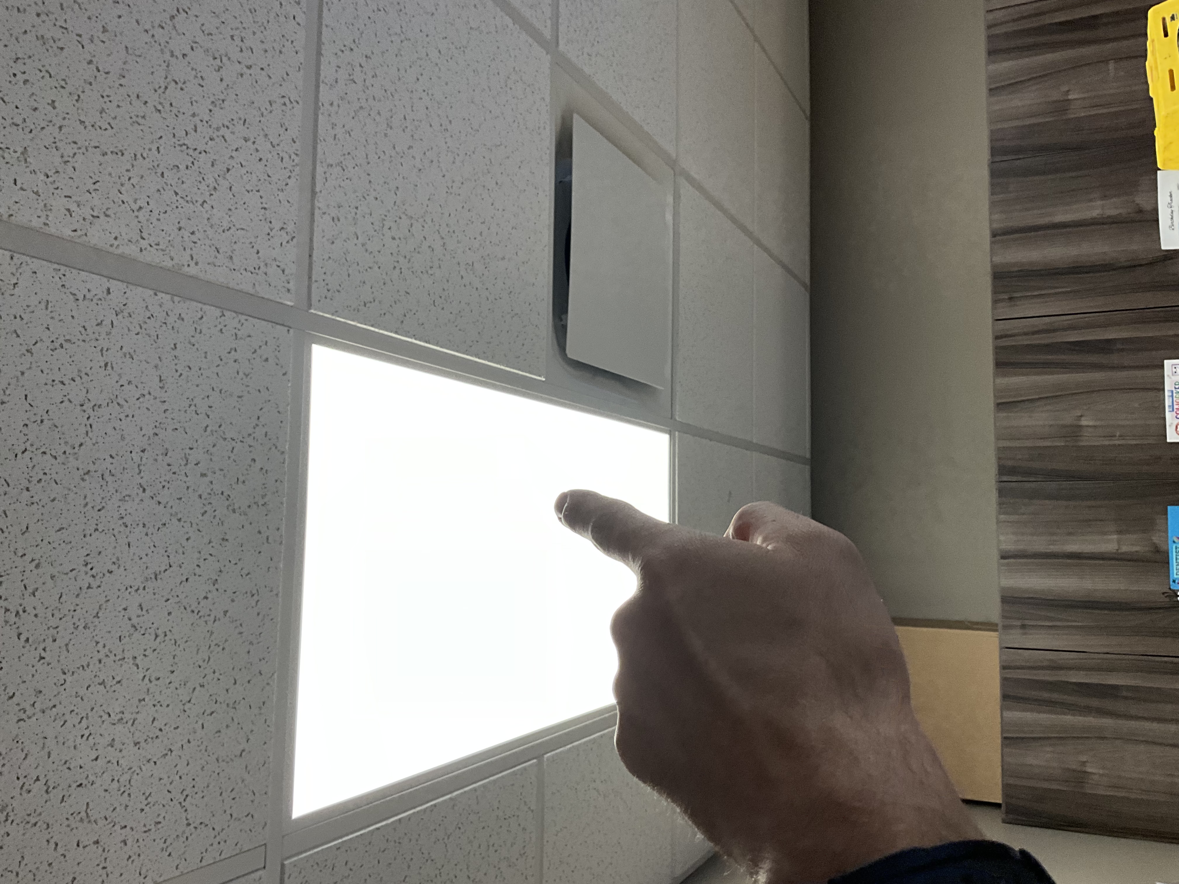 Upon arrival, the existing LED flat panel light fixture was assessed due to intermittent operation and occasional flickering. During diagnostics, the fixture was observed flickering while energized but remained functional. The intermittent nature of the issue indicated an internal failure within the fixture and/or integrated LED driver. The replacement involved removing the existing fixture, installing a new LED flat panel fixture of comparable size and color temperature, and reconnecting it to the existing electrical wiring. The new fixture was secured in its current location, and thorough testing was conducted to ensure proper operation and normal performance. All electrical connections were verified, and the new fixture was confirmed to be fully functional before completion.