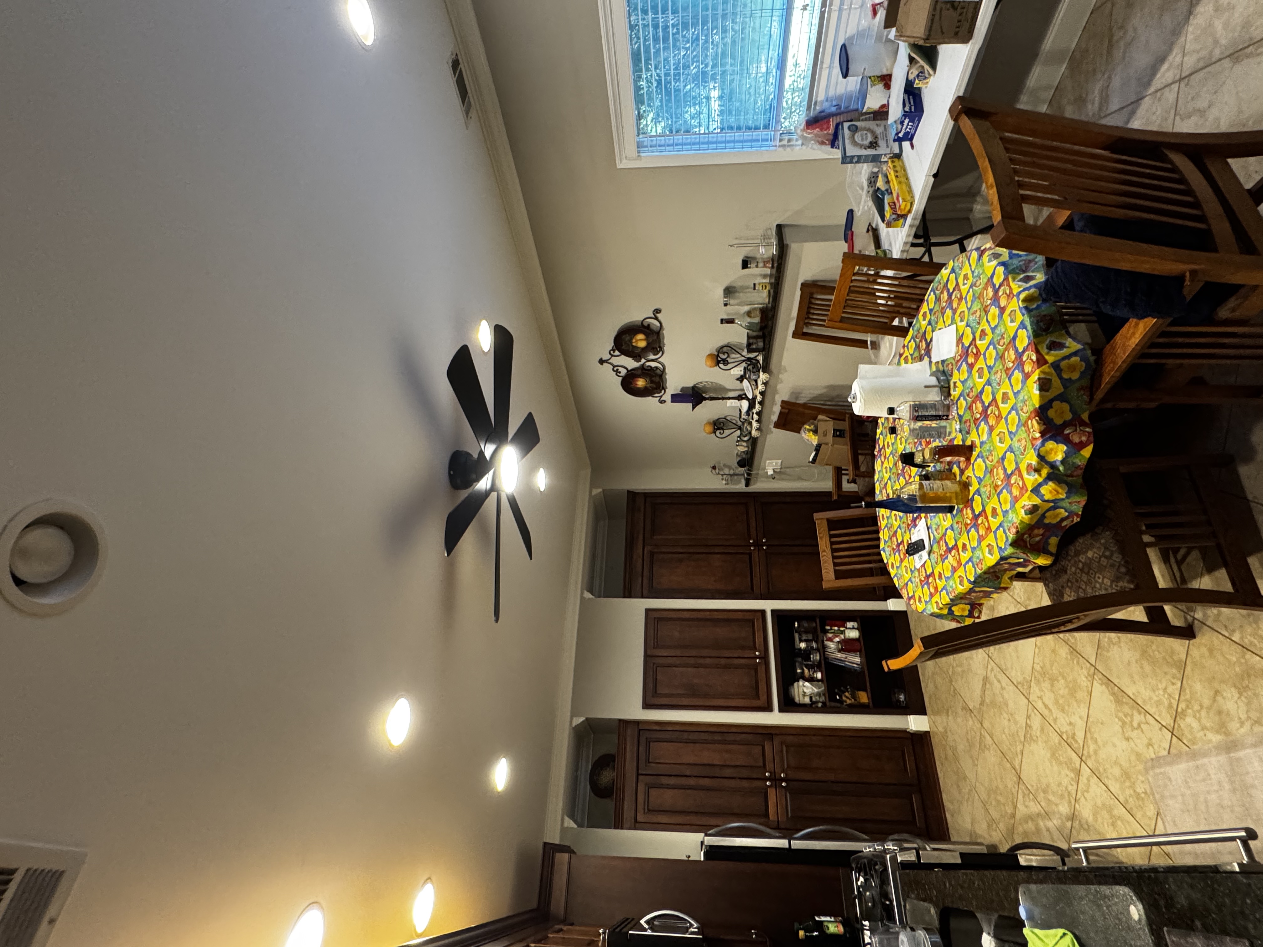 We installed new electrical wiring, wall switches, and fan-rated ceiling junction boxes in two basement areas. Sheetrock removal was necessary for access. In the dining room, we removed an existing light fixture and installed a chain-mounted chandelier. All electrical connections were made, and the fixture was secured. We tested all wiring and switches for proper operation, adhering to electrical codes and manufacturer requirements.