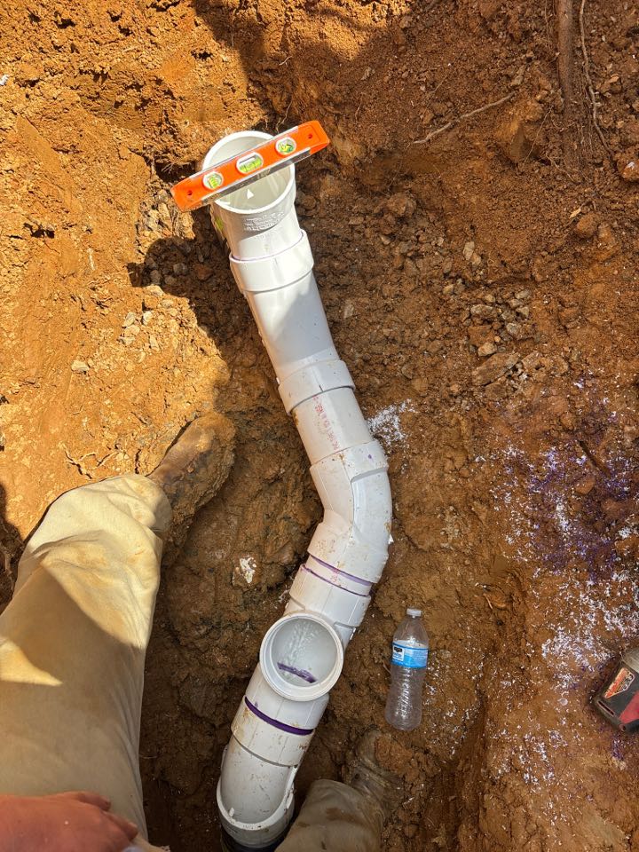 Spot repair on a broken sewer line with tree roots growing inside