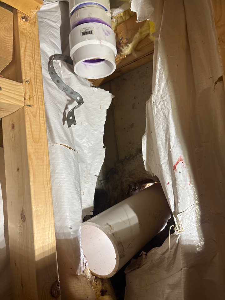 Repairing a cracked sewer line within the foundation wall