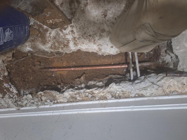 Dug up and repaired 3 feet of copper under concrete floor Dug up and repaired 3 feet of copper under concrete floor