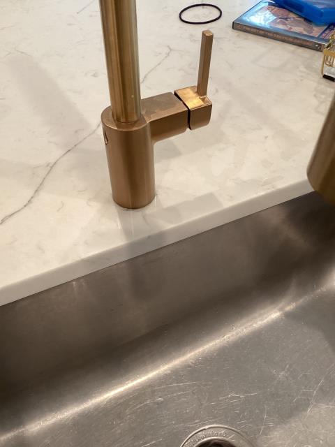 Removed blockage from tub drain.  Tightened kitchen faucet