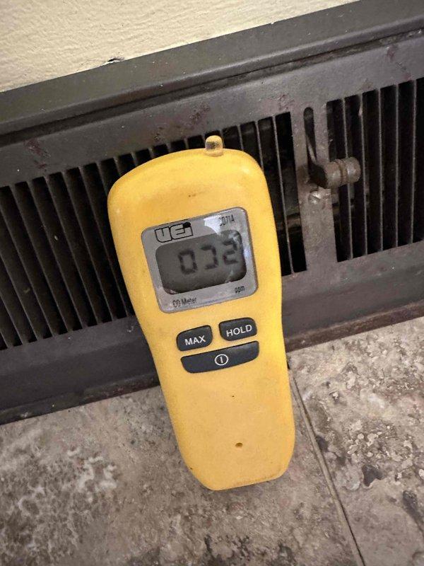 Responded to carbon monoxide alarm activation in recently purchased home with 15-20 year old HVAC system. Conducted comprehensive CO testing using UEI CO meter, detecting elevated levels (32 ppm) at HVAC register. After thorough system inspection and ventilation, CO levels decreased to safe readings (2 ppm). Identified and repaired furnace ventilation leak causing carbon monoxide intrusion.