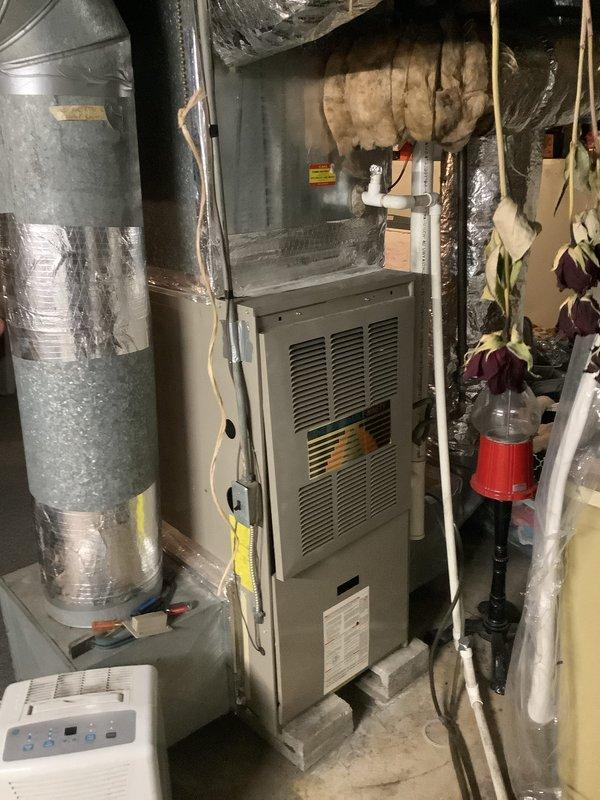 Completed residential HVAC system replacement estimate for non-functional equipment. Inspection revealed aging furnace with deteriorating ductwork connections and insulation issues. Documented existing system configuration including gas furnace unit and associated ventilation components to prepare comprehensive replacement options.