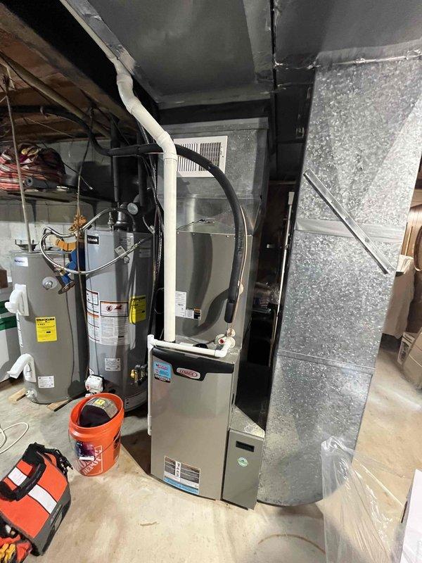 Completed planned maintenance visit on Lennox HVAC system located in basement utility room. Inspected equipment, ductwork, and digital thermostat (currently set at 69° heat/76° cool with 59° ambient temperature). Noted system is due for 16x25x5 filter replacement and requires service plan renewal as this was the second maintenance visit since installation two years ago.