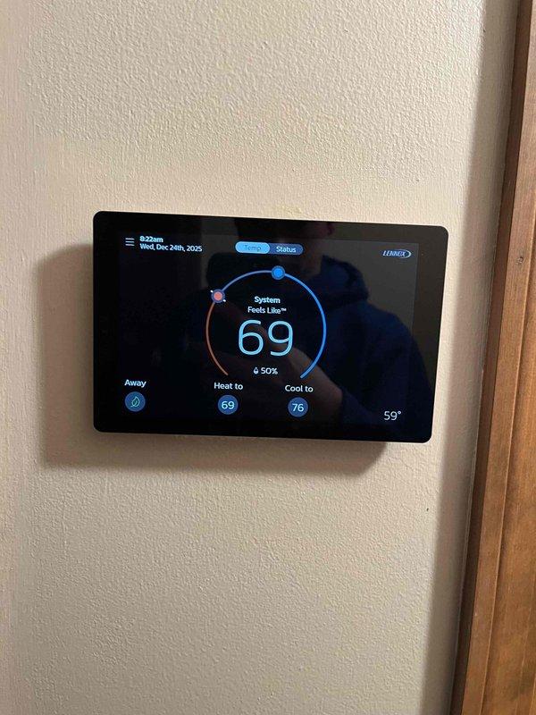 Completed planned maintenance visit on Lennox HVAC system located in basement utility room. Inspected equipment, ductwork, and digital thermostat (currently set at 69° heat/76° cool with 59° ambient temperature). Noted system is due for 16x25x5 filter replacement and requires service plan renewal as this was the second maintenance visit since installation two years ago.