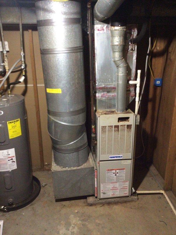 Diagnosed Tempstar furnace located in basement requiring control board replacement. System assessment identified board failure as source of malfunction. Documented model/serial information and captured detailed photos of control board for accurate part ordering. Customer paid in full; furnace will be operational once replacement board is installed during follow-up appointment.