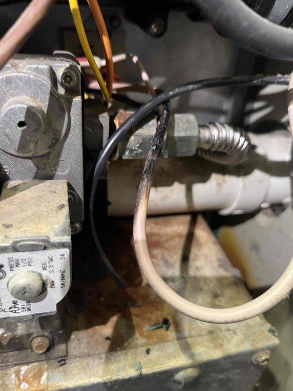 Responded to service call for 20+ year-old heating system with no operation. Diagnosed failed thermostat (no display) and significant corrosion in exhaust flue. Visual inspection revealed damaged wiring connections and deteriorated internal components. Presented repair options and provided replacement system quote as requested by homeowner due to system age and extent of deterioration.