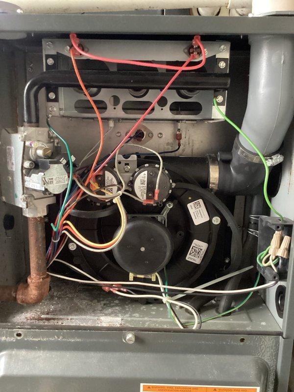 Performed routine platinum-level maintenance on HVAC system. Replaced heavily soiled 16x25x5 air filter (KOCH brand) which showed significant dust accumulation. Inspected blower motor assembly and electrical connections, noting normal dust buildup but all wiring (red, green, yellow, white) remained secure and functional.