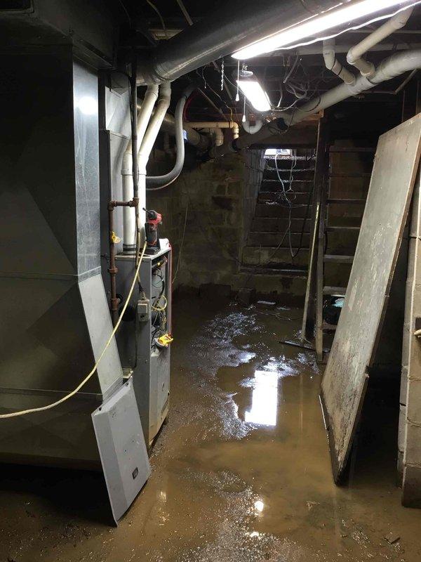 Responded to a no-heat service call and discovered significant basement flooding affecting the furnace. Upon inspection, the inducer motor showed signs of failure. Due to the hazardous conditions of standing water near electrical components, repairs could not be safely performed until water remediation is completed.