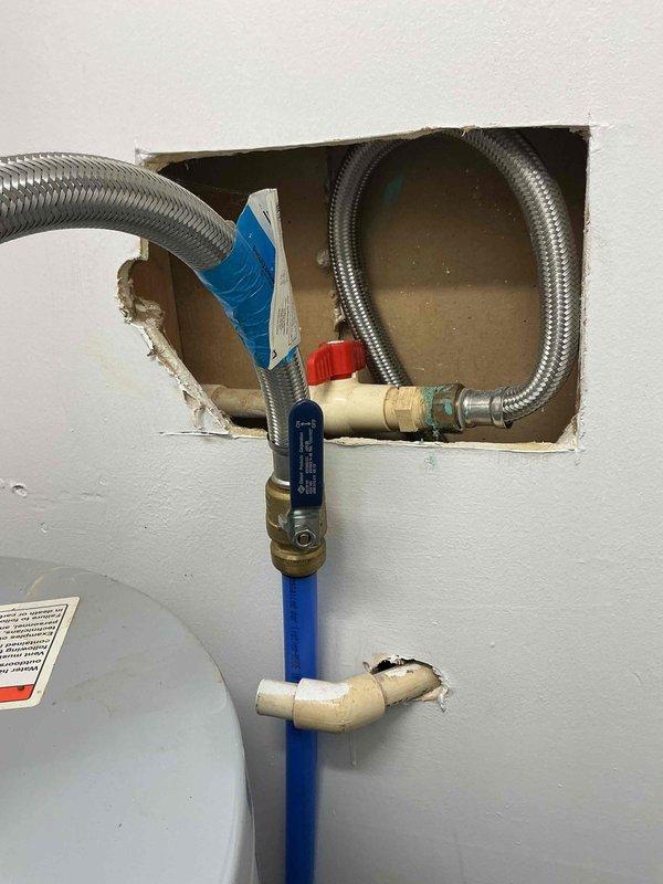 Completed assessment of client's water heater needs, examining existing Lochinvar unit installed in 2015. Inspected plumbing connections, including PVC piping, brass valves, and flexible hoses. Discussed tankless water heater options and membership benefits as requested by customer.