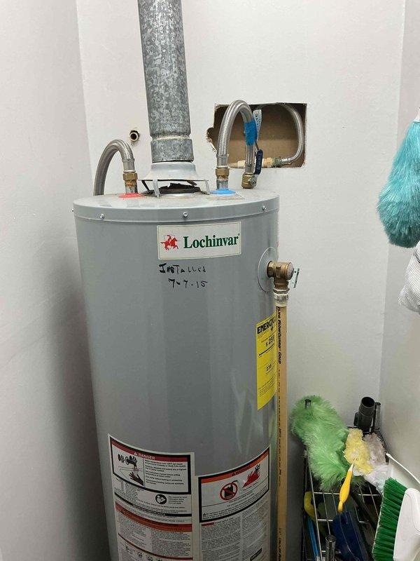 Completed assessment of client's water heater needs, examining existing Lochinvar unit installed in 2015. Inspected plumbing connections, including PVC piping, brass valves, and flexible hoses. Discussed tankless water heater options and membership benefits as requested by customer.