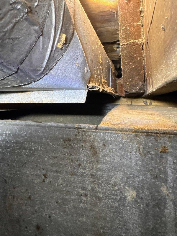 Performed comprehensive duct cleaning service in a confined space, accessing areas with deteriorated building materials and aging infrastructure. Successfully addressed dust accumulation and debris in the ductwork system, focusing particularly on areas where wooden structural elements interface with mechanical components. Documented pre/post service conditions with photographs to verify effective removal of contaminants.