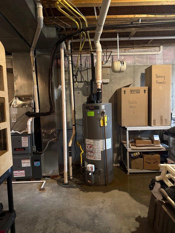 Completed replacement of malfunctioning generator in basement utility room. Performed verification checks on installation to ensure proper integration with existing HVAC and water heating systems. All connections properly secured and system tested for full operational functionality.