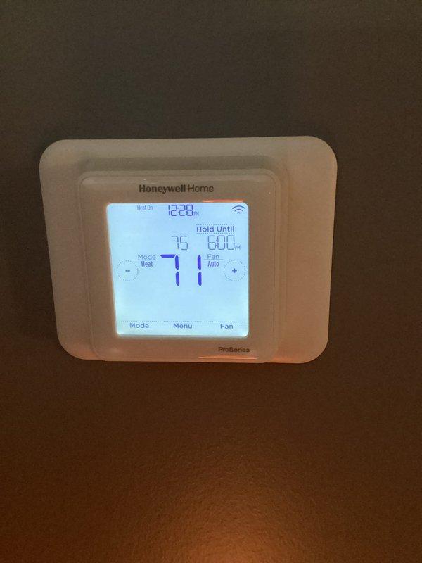 Performed annual maintenance on a residential HVAC system. Inspected and replaced the 16x25x5 air filter as part of the planned service. Verified thermostat operation; system functioning properly in heating mode at 71°F with a scheduled temperature hold.