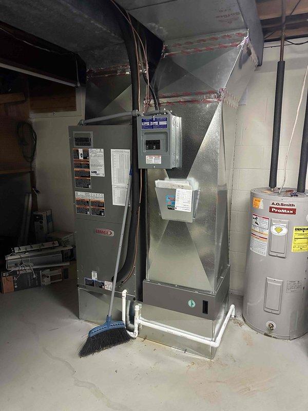 Successfully installed a 3-ton 19 SEER Lennox heat pump system in Mount Vernon, including outdoor condenser unit positioned on concrete pad with proper clearances and air handler in the basement utility room adjacent to existing water heater. All ductwork connections were properly sealed with metallic tape and system was tested for normal operation after installation.
