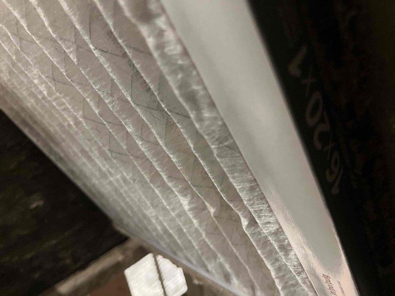 Performed inspection of existing electric heat pump system located in utility closet with louvered door access. System is serving a small-to-mid sized home (1001-1599 sq.ft.). Documented condition of air handler unit, ductwork connections, and examined air filter which showed significant pleating wear. Customer is interested in full heating and cooling system replacement options.
