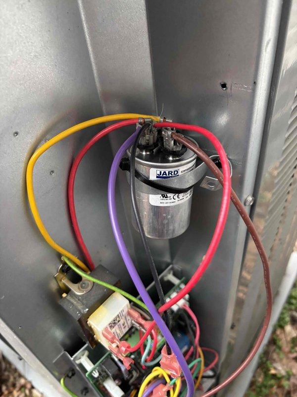 Diagnosed 5-year-old HVAC system with no airflow and complete system failure despite intact breakers. Inspected electrical components including JARD capacitor and Emerson control board, finding faulty relay switch causing communication failure between thermostat and unit. Replaced relay switch, restored proper circuit communication, and verified system operation with normal airflow restored.