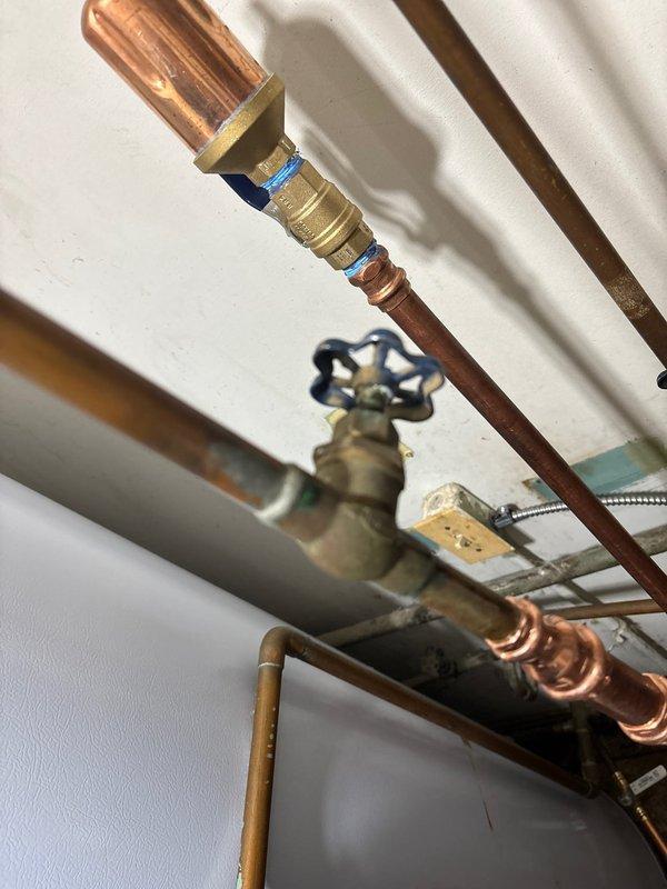 Performed follow-up visit to address Alert 270 (GF flame failed to ignite) error on thermostat that occurs when outdoor temperature drops below 20°F, causing indoor temperature to fall to 55°F. Inspected furnace unit and associated PVC ventilation system, along with copper plumbing connections and gas valve. Resolved ignition failure issue to ensure proper heating function during low outdoor temperatures.