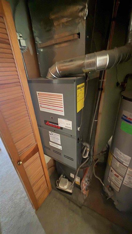 Conducted comprehensive site evaluation for generator installation. Inspected existing electrical service panel, conduit placement, and utility meter configuration on exterior brick wall. Assessed HVAC furnace and water heater setup in utility space to determine optimal generator integration points and ensure compatibility with household systems.