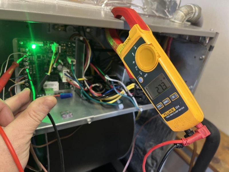 Conducted follow-up service to address previously incomplete work. Performed electrical diagnostics using Fluke 324 clamp meter on control panel, confirming 227V reading with proper circuit operation indicated by green LED status light. Inspected and verified replacement heat kit installation per prior service notes.