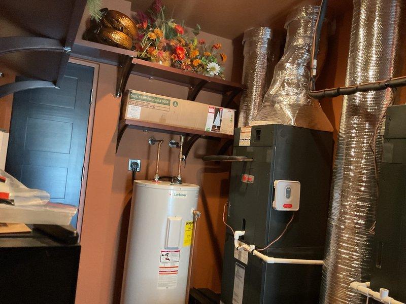 Conducted a comprehensive replacement estimate for one non-functioning HVAC system out of three total units on property. Inspected existing outdoor condensing units installed on concrete pad and evaluated indoor furnace system with attached ductwork. Documented current equipment configuration to prepare appropriate replacement options for the homeowner.