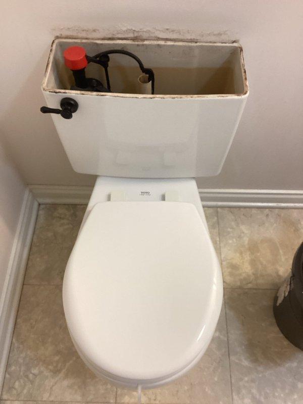 Responded to customer concern regarding two slow-flushing toilets. Performed visual inspection of both TOTO toilets, revealing mineral buildup and scale deposits within the tanks, affecting the flush valve assemblies. Snaked both toilets to clear any blockages and restore proper water flow and drainage function. Both units now flushing properly at normal speed.
