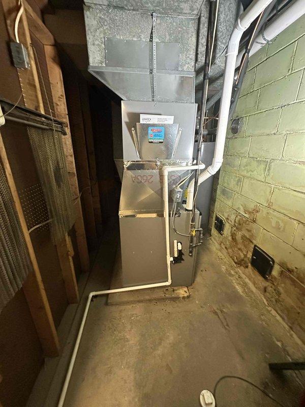 Completed installation of a Lennox 97% high-efficiency furnace in basement utility room. Unit was properly mounted with appropriate clearances, connected to existing ductwork, and fitted with new PVC intake/exhaust piping. All electrical connections were secured and system was tested for proper operation.