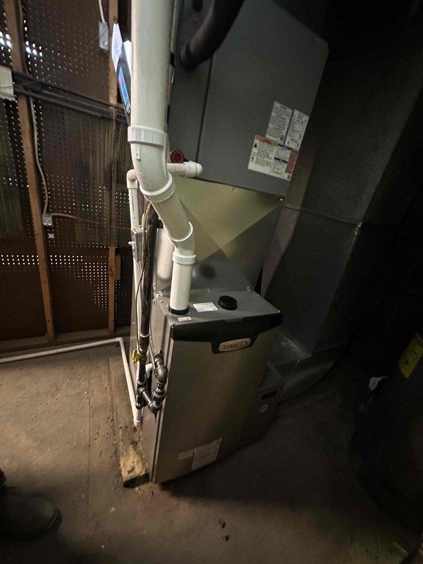 Completed installation of a Lennox 97% high-efficiency furnace in basement utility room. Unit was properly mounted with appropriate clearances, connected to existing ductwork, and fitted with new PVC intake/exhaust piping. All electrical connections were secured and system was tested for proper operation.