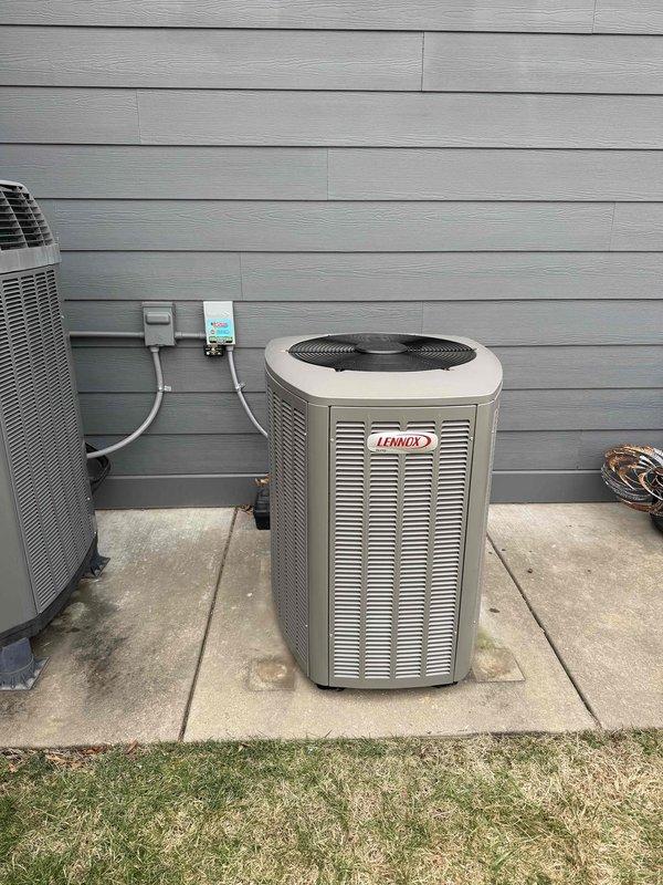 Completed installation of a 2-ton Lennox heat pump system with matching air handler for customer Chandler. Installed outdoor heat pump unit on concrete pad with proper electrical connections and verified system labels and warnings were intact. Job was sold by Jake.