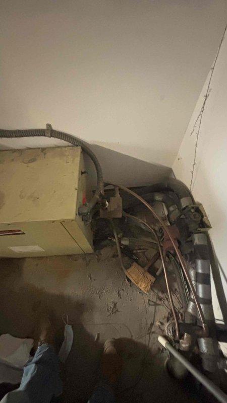 Conducted a comprehensive evaluation of the existing HVAC system for Jenny (executor of mother's estate) who expressed interest in both geothermal and traditional replacement options. Inspected the current equipment including the AO Smith water heater and connected HVAC components with ductwork, documenting the mechanical room setup with detailed photos for accurate replacement specifications and future reference.