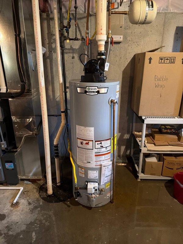 Successfully installed a new 50-gallon A.O. Smith power vent water heater, complete with all necessary plumbing connections including copper supply lines and PVC venting. Installed expansion tank and verified proper operation of unit. Work completed under permit #2601-001367.